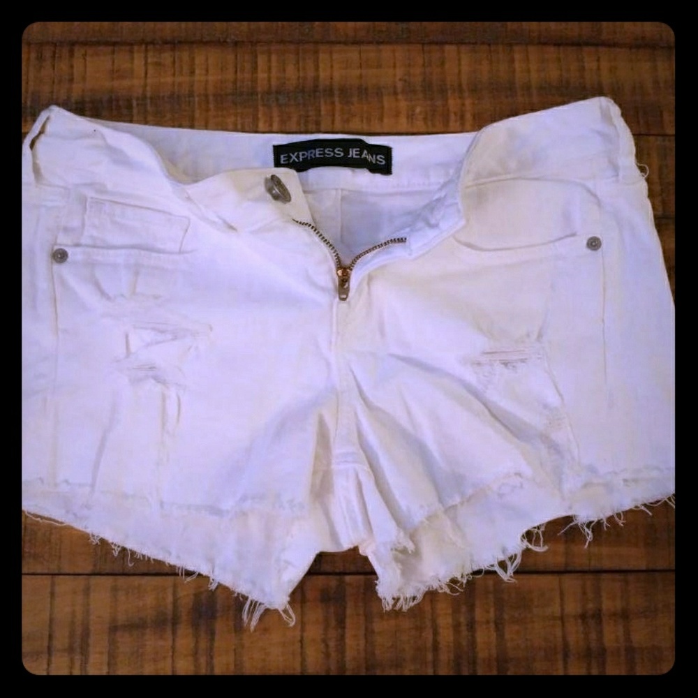 Distressed white jean shorts